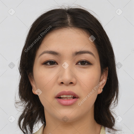 Joyful asian young-adult female with medium  brown hair and brown eyes