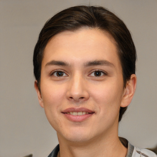 Joyful white young-adult female with short  brown hair and brown eyes