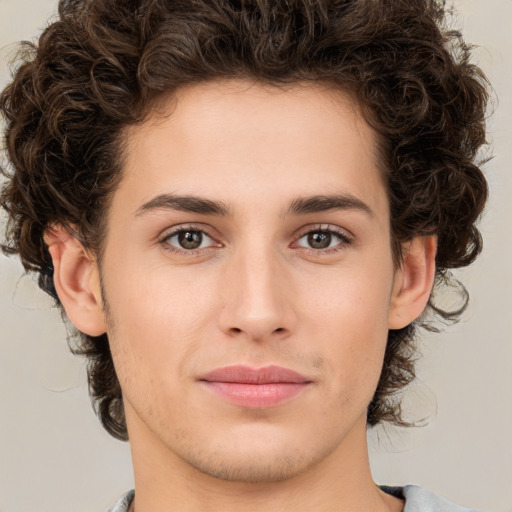 Joyful white young-adult male with medium  brown hair and brown eyes