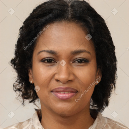 Joyful black adult female with medium  brown hair and brown eyes