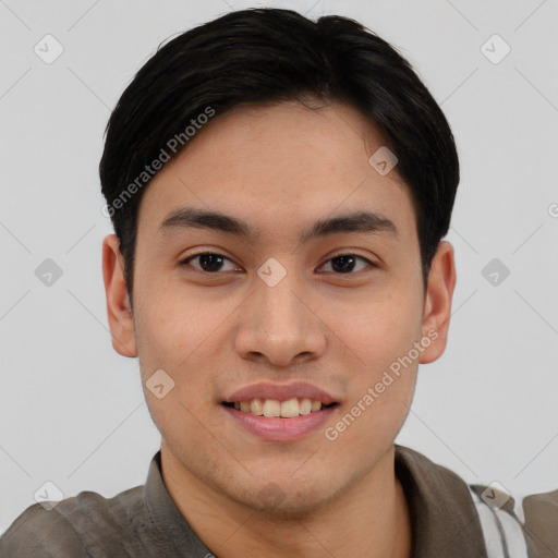 Joyful asian young-adult male with short  brown hair and brown eyes