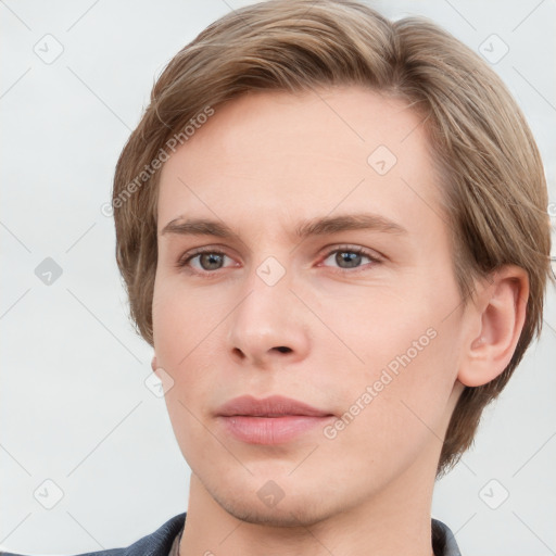 Neutral white young-adult male with short  brown hair and grey eyes