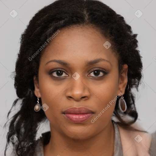 Joyful black young-adult female with long  brown hair and brown eyes