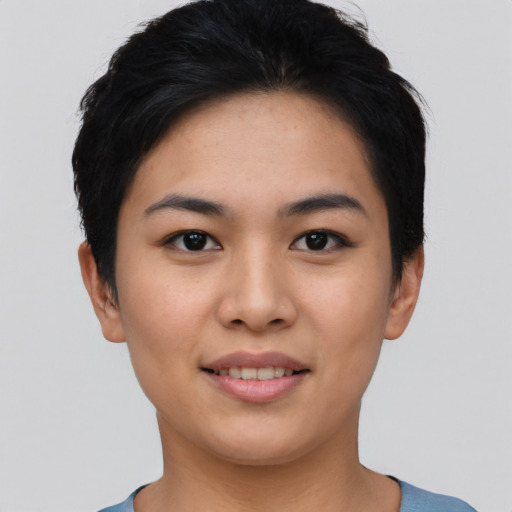 Joyful asian young-adult female with short  black hair and brown eyes