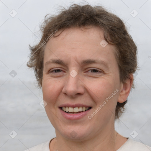 Joyful white adult female with short  brown hair and brown eyes