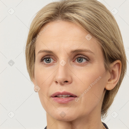 Joyful white adult female with medium  brown hair and grey eyes