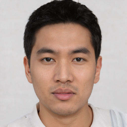Neutral asian young-adult male with short  black hair and brown eyes