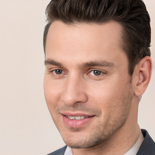 Joyful white young-adult male with short  brown hair and brown eyes