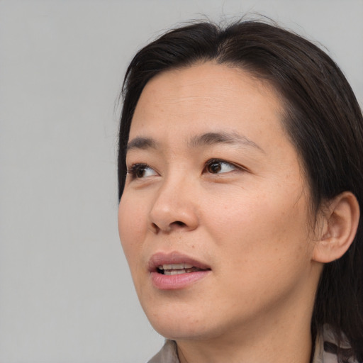 Neutral asian young-adult female with short  brown hair and brown eyes