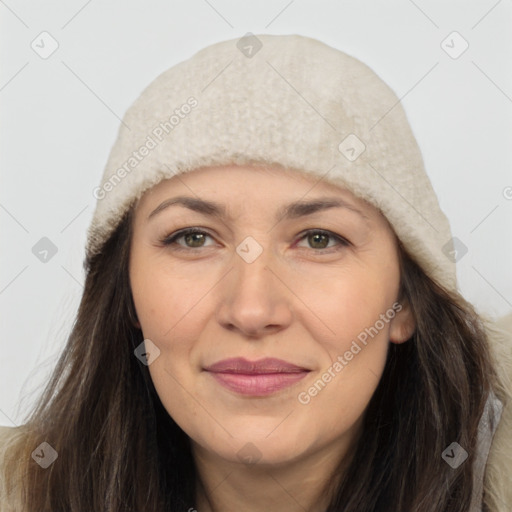 Joyful white adult female with long  brown hair and brown eyes