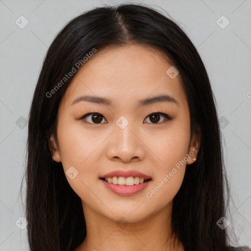 Joyful asian young-adult female with long  brown hair and brown eyes