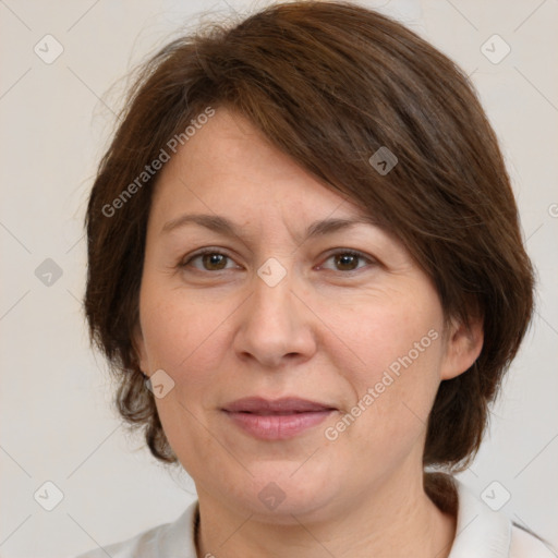 Joyful white adult female with medium  brown hair and brown eyes