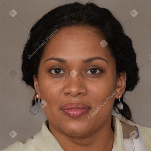 Joyful black adult female with medium  brown hair and brown eyes