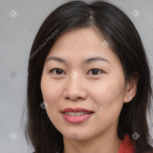 Joyful asian young-adult female with long  brown hair and brown eyes