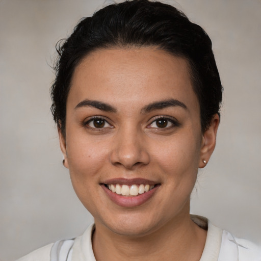 Joyful white young-adult female with short  brown hair and brown eyes