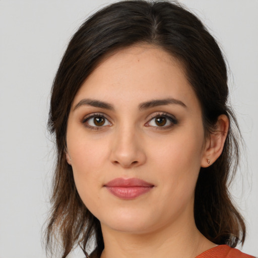 Joyful white young-adult female with medium  brown hair and brown eyes