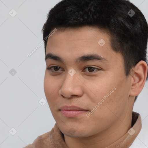 Joyful latino young-adult male with short  black hair and brown eyes