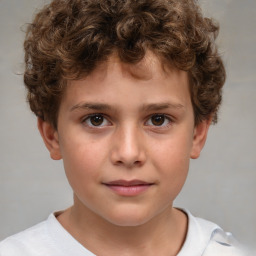 Joyful white child male with short  brown hair and brown eyes