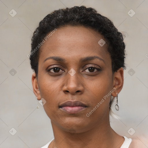 Neutral black young-adult female with short  brown hair and brown eyes