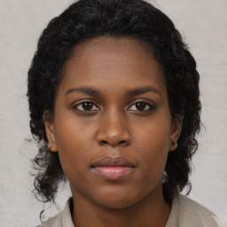 Neutral black young-adult female with medium  brown hair and brown eyes