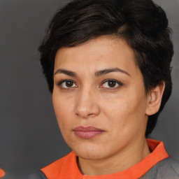 Joyful white adult female with short  brown hair and brown eyes