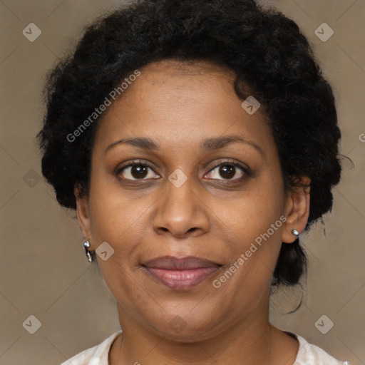 Joyful black adult female with short  brown hair and brown eyes