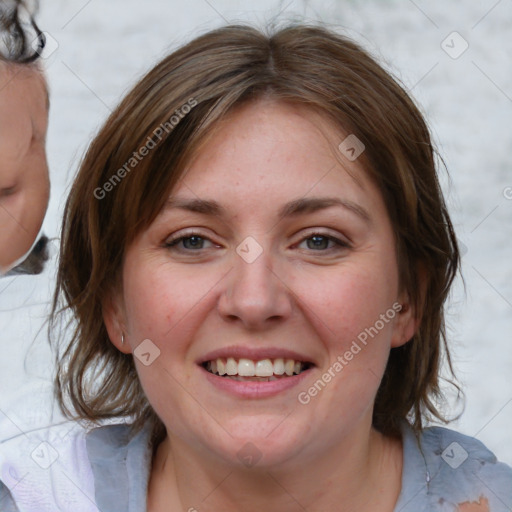 Joyful white young-adult female with medium  brown hair and blue eyes