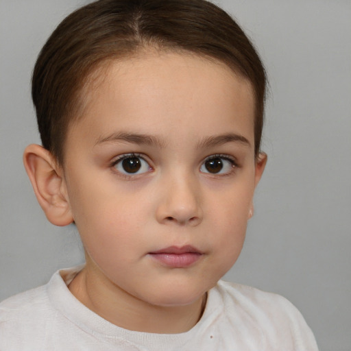 Neutral white child female with short  brown hair and brown eyes