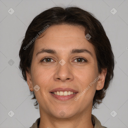 Joyful white adult female with medium  brown hair and brown eyes