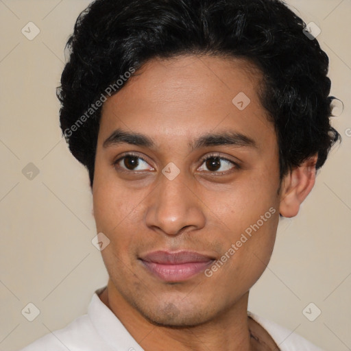 Joyful latino young-adult male with short  brown hair and brown eyes