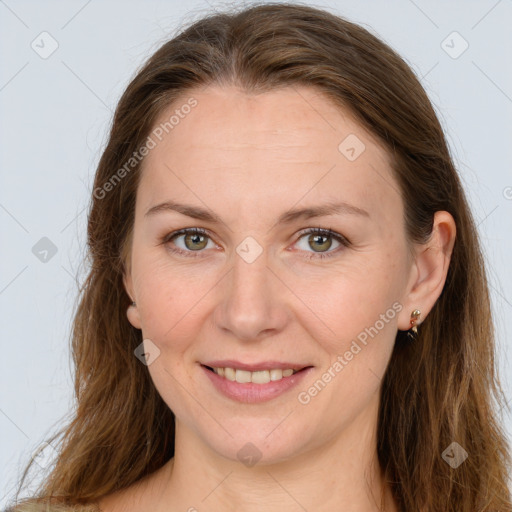 Joyful white adult female with long  brown hair and grey eyes