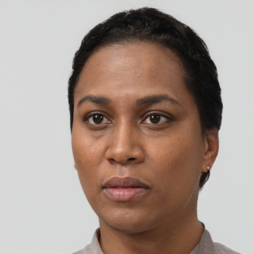 Neutral black young-adult female with short  black hair and brown eyes