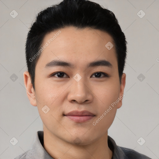 Joyful asian young-adult male with short  black hair and brown eyes