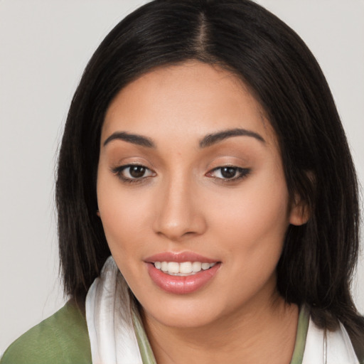 Joyful asian young-adult female with long  brown hair and brown eyes