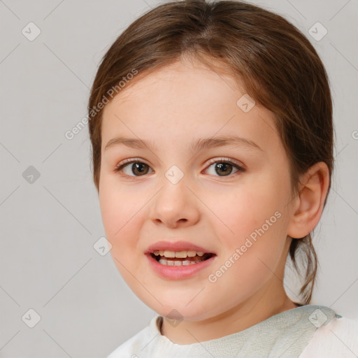 Joyful white child female with medium  brown hair and brown eyes