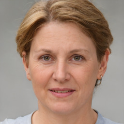 Joyful white adult female with short  brown hair and grey eyes