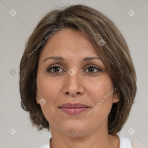 Joyful white adult female with medium  brown hair and brown eyes