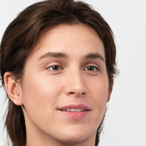 Joyful white young-adult male with medium  brown hair and brown eyes