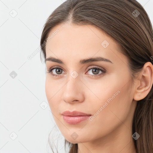 Neutral white young-adult female with long  brown hair and brown eyes