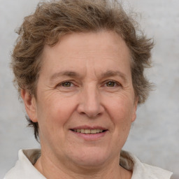 Joyful white middle-aged female with short  brown hair and brown eyes