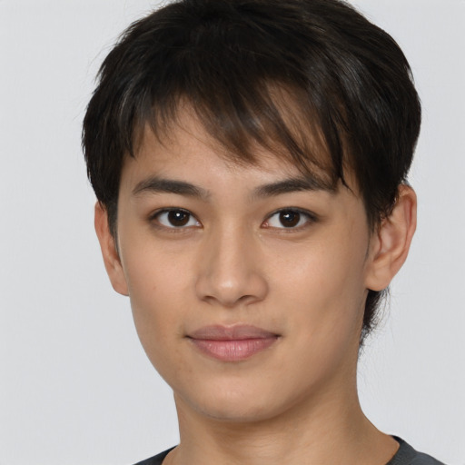 Joyful asian young-adult female with short  brown hair and brown eyes