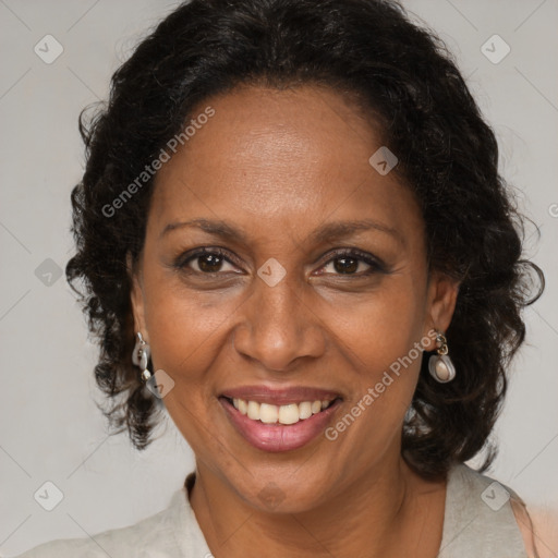 Joyful black adult female with medium  brown hair and brown eyes