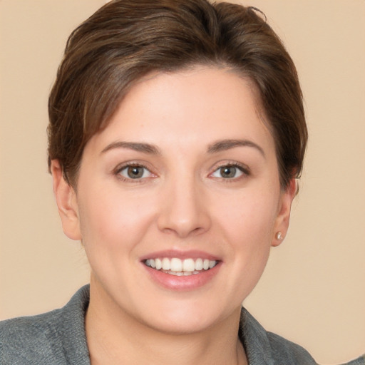 Joyful white young-adult female with short  brown hair and brown eyes