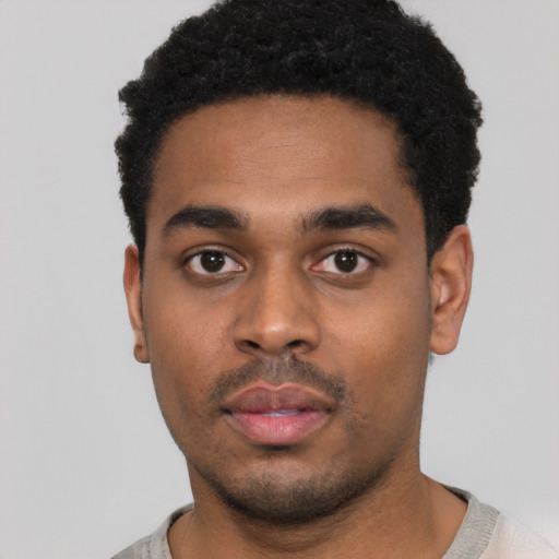 Neutral black young-adult male with short  black hair and brown eyes