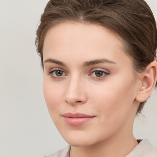 Neutral white young-adult female with medium  brown hair and grey eyes