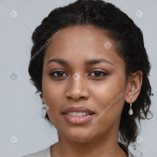 Joyful latino young-adult female with long  black hair and brown eyes