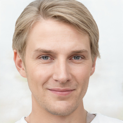 Joyful white adult male with short  brown hair and grey eyes