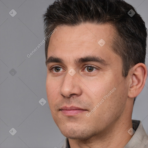 Joyful white adult male with short  brown hair and brown eyes