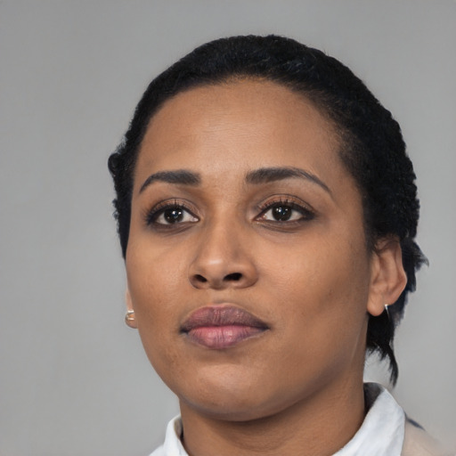 Neutral black young-adult female with short  black hair and brown eyes