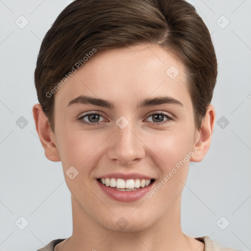 Joyful white young-adult female with short  brown hair and grey eyes